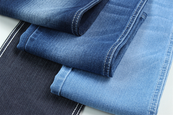 Özel sütten kesme 10.3 oz koyu mavi düşük germe kot pantolon kumaşı